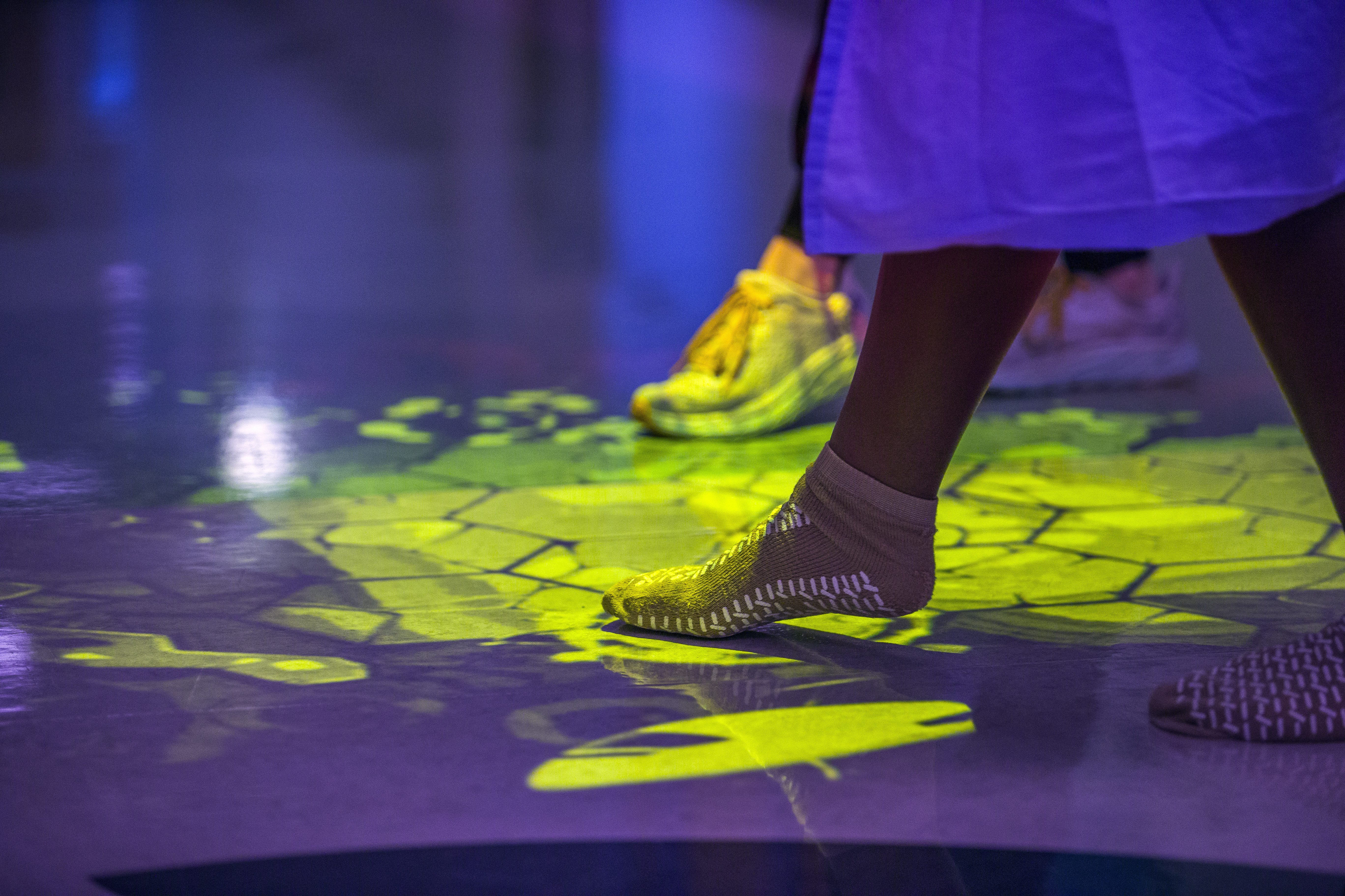 A Saint Francis patient's foot wearing a sock, tapping the floor