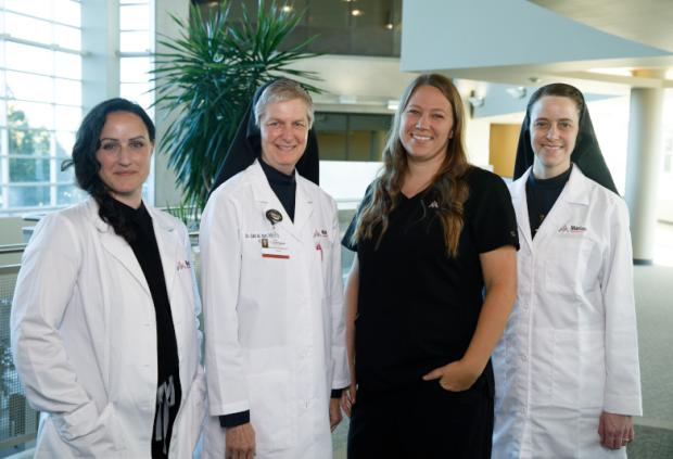 Group photo of Marian Medical Clinic doctors and nurses