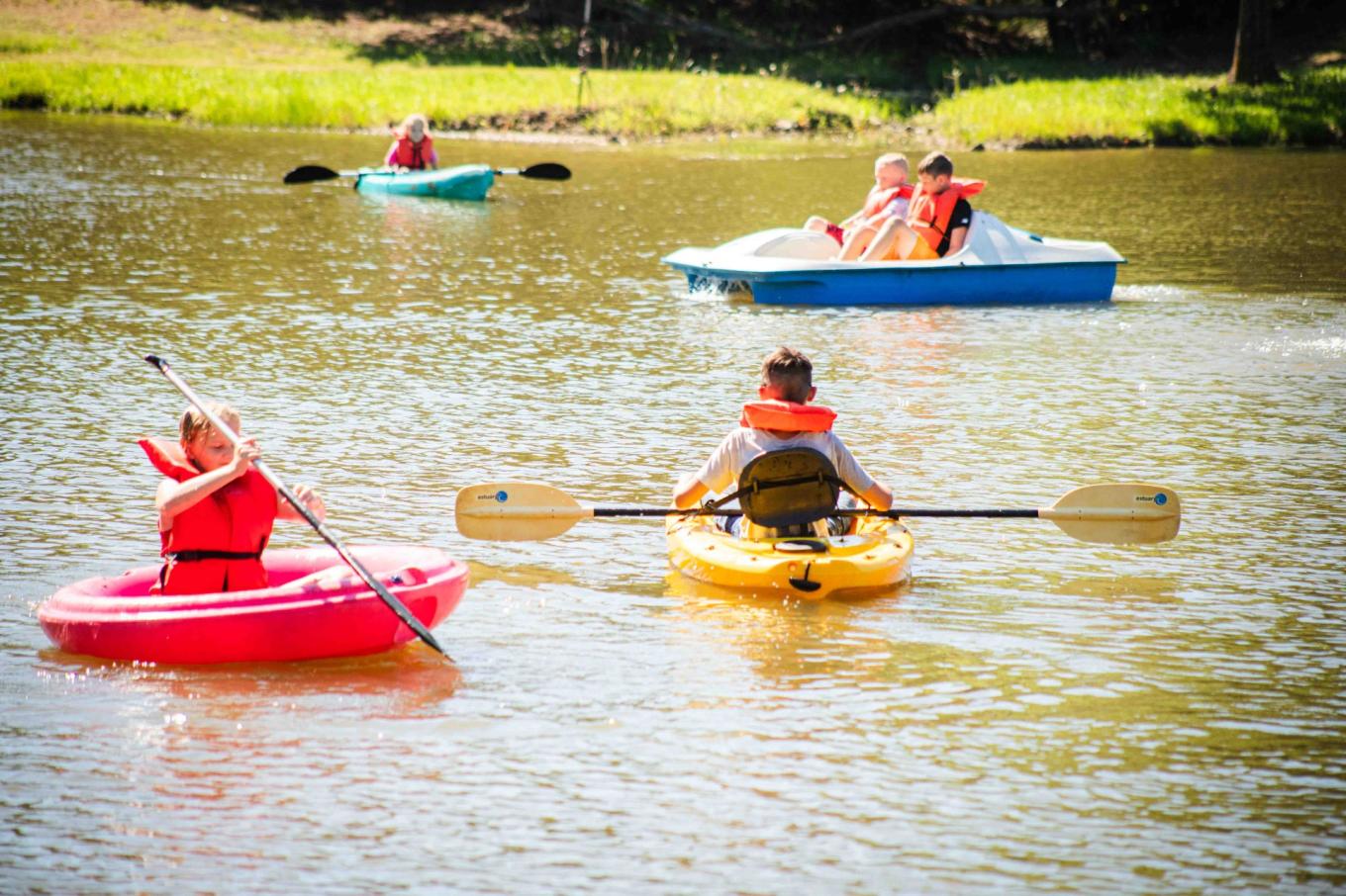 Kids kayaking in lake