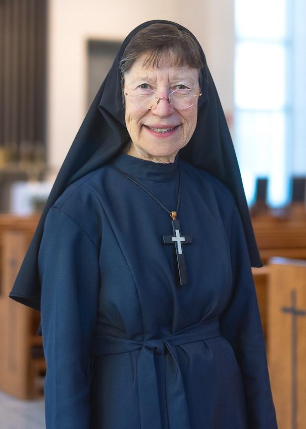 Sister Marysia Weber smiling inside of a chapel