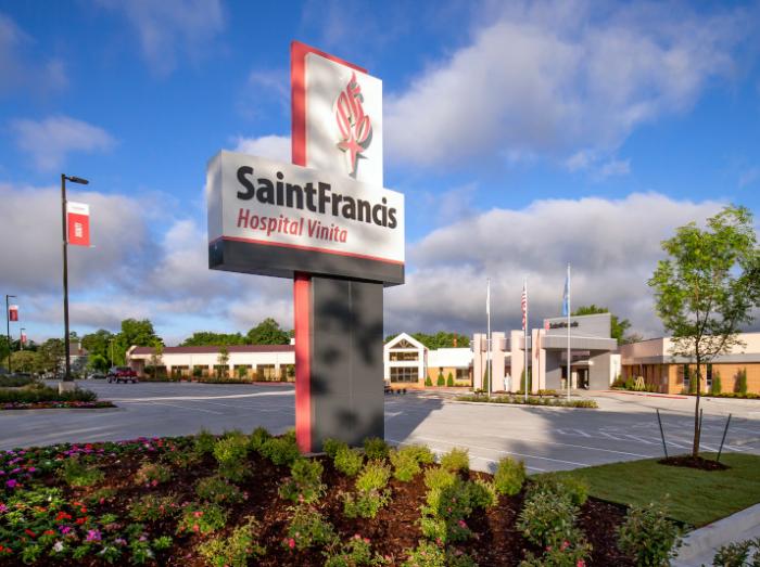 Exterior view of Saint Francis Hospital Vinita sign, building and landscaping on a sunny day