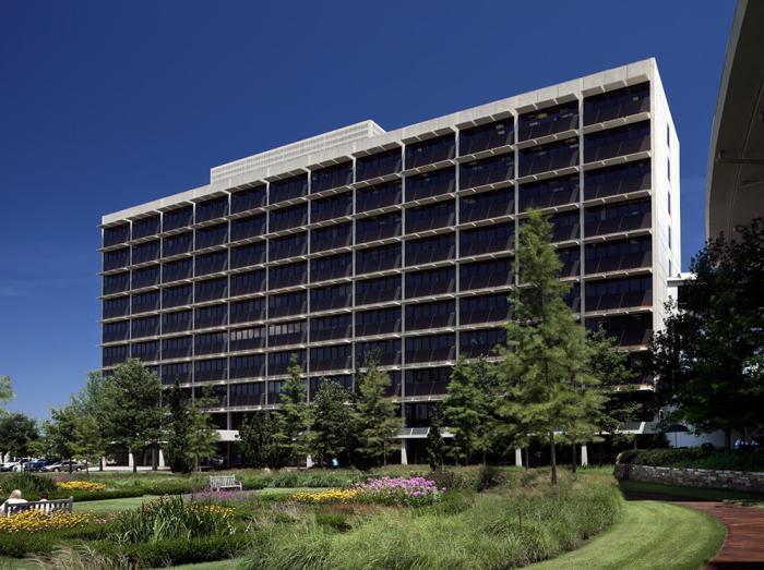 Exterior view of Warren Building on a sunny day with trees and landscaping in foreground