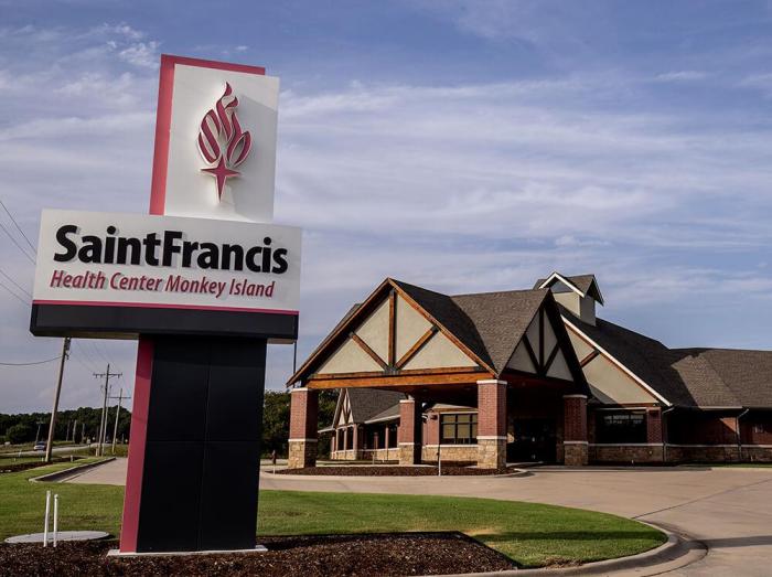 Exterior view of Saint Francis Physical Medicine and Rehabilitation Monkey Island with outdoor sign in foreground