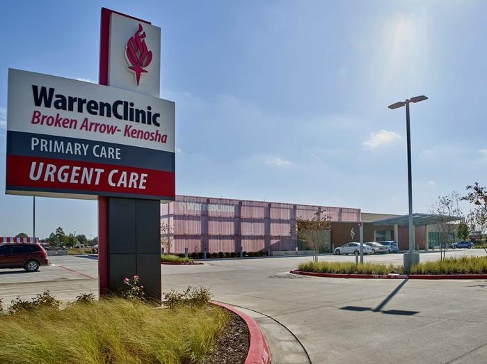 Exterior view of Warren Clinic Broken Arrow - Kenosha building with sign in foreground