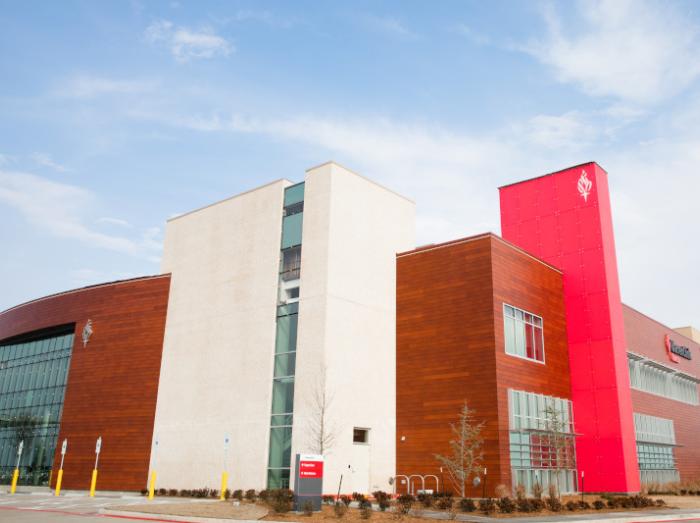 Exterior view of Warren Clinic Owasso building under a blue sky