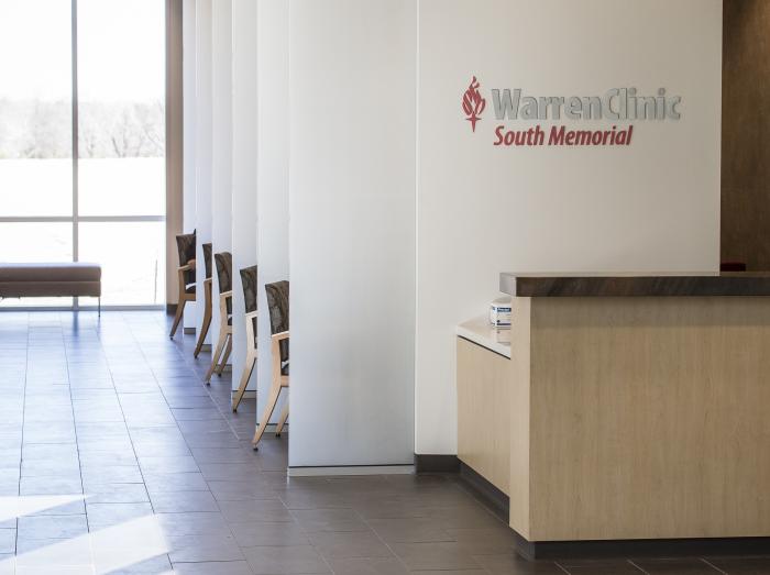 Interior view of Warren Clinic South Memorial front desk with lobby in background