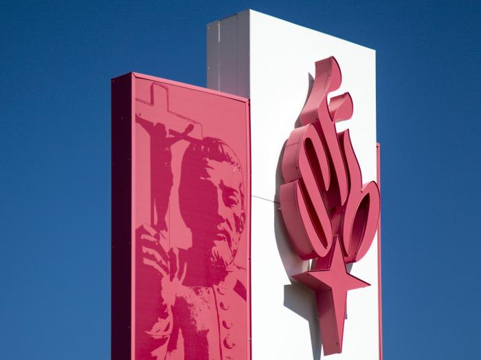 Placeholder image of health system exterior sign with torch logo