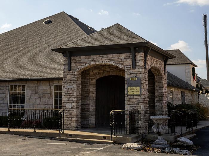 Exterior view of Warren Clinic South Tulsa main entrance on a sunny day