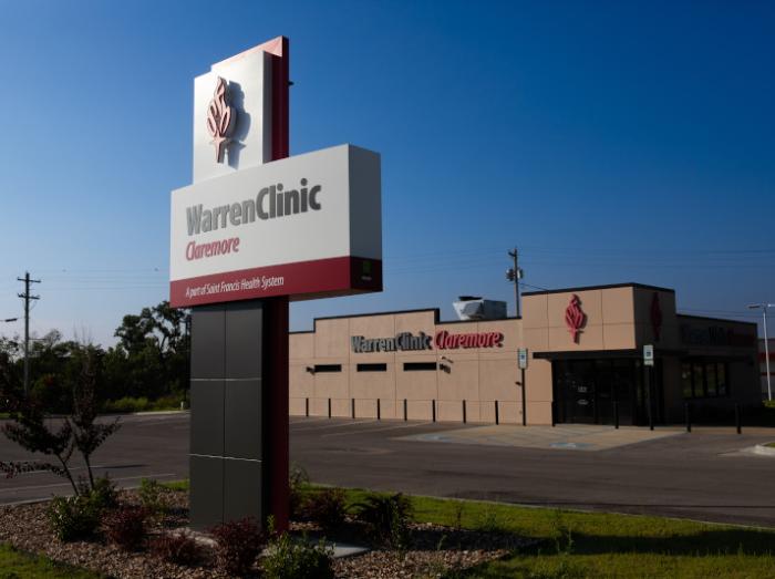 Exterior view of Warren Clinic Claremore building with large sign in foreground