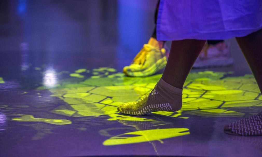 A Saint Francis patient's foot wearing a sock, tapping the floor