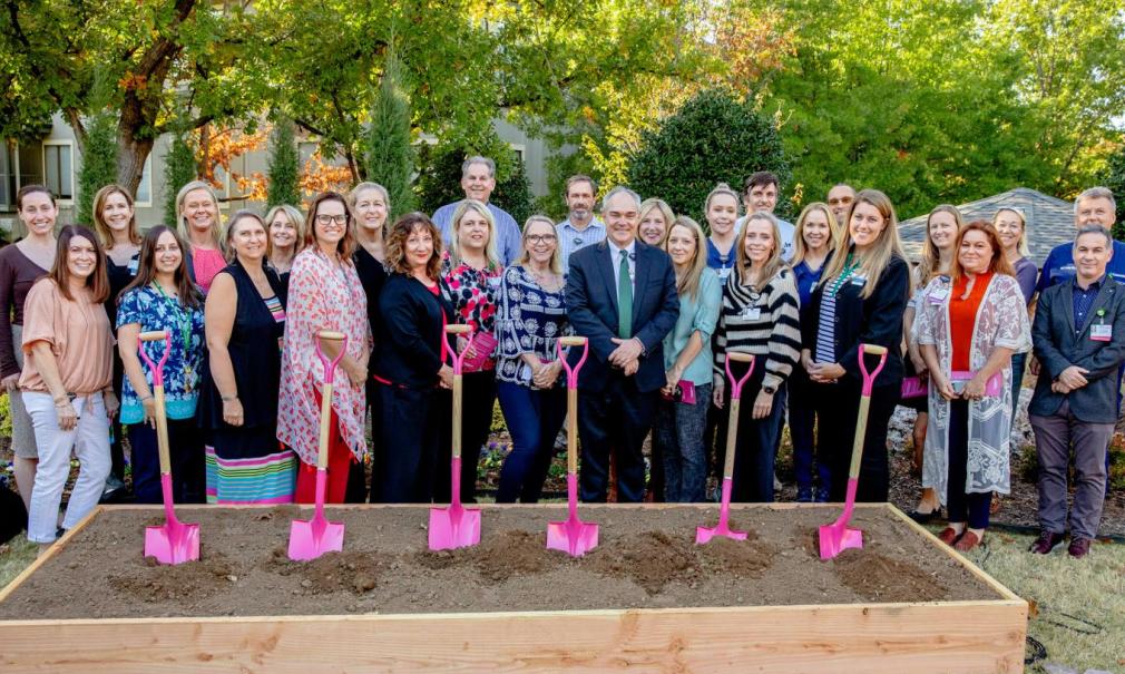A group photo of key stakeholders breaking ground on the Laureate facility expansion