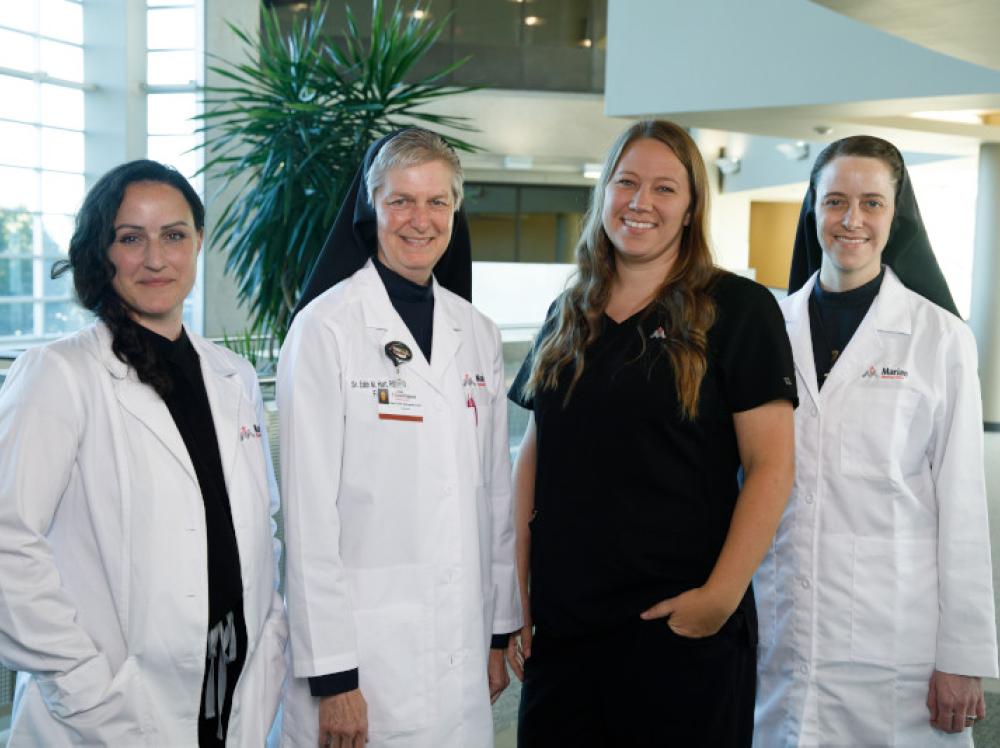 Group photo of Marian Medical Clinic doctors and nurses