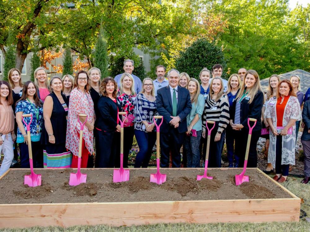 A group photo of key stakeholders breaking ground on the Laureate facility expansion