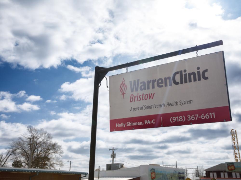 Exterior warren clinic Bristow sign with blue sky in background