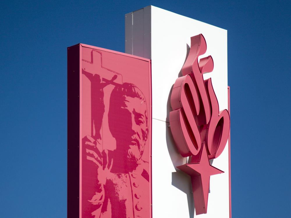 Placeholder image of health system exterior sign with torch logo